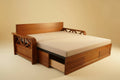 Wooden bed frame with beige mattress and pillows